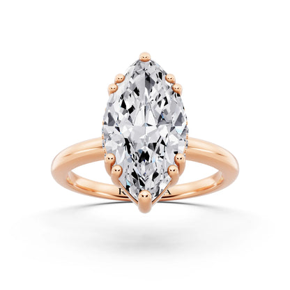 18 KT Rose Gold Marquise Cut Diamond Solitaire Ring with Hidden Accent Basket - front view