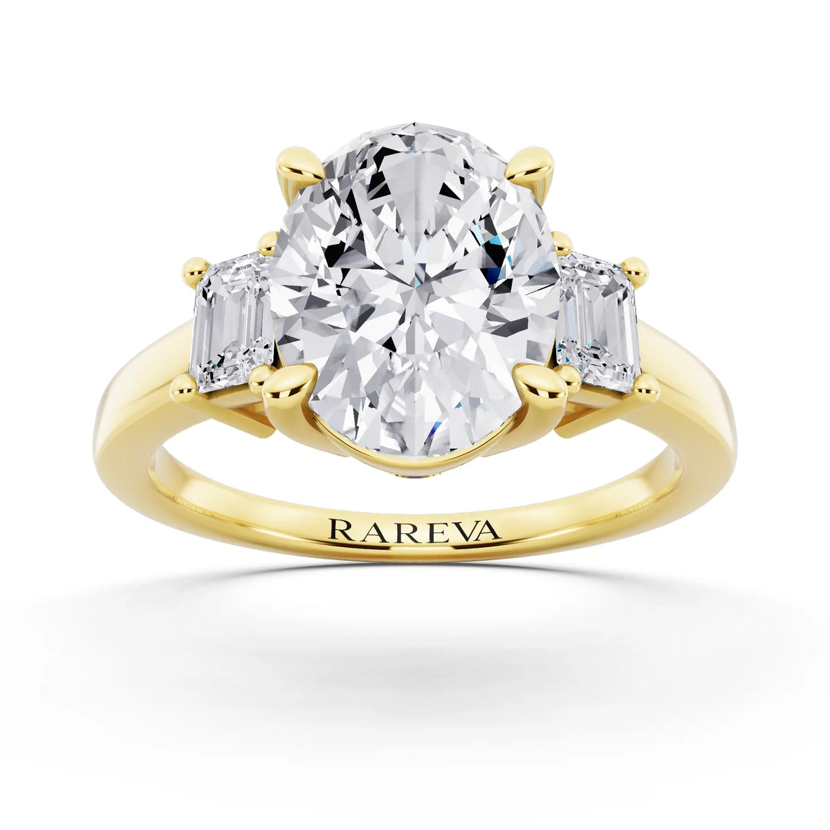 18 KT Yellow Gold Oval Cut Diamond Three Stone Emerald Accent Ring - front view