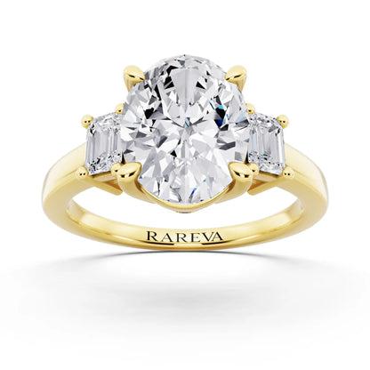 18 KT Yellow Gold Oval Cut Diamond Three Stone Emerald Accent Ring - front view