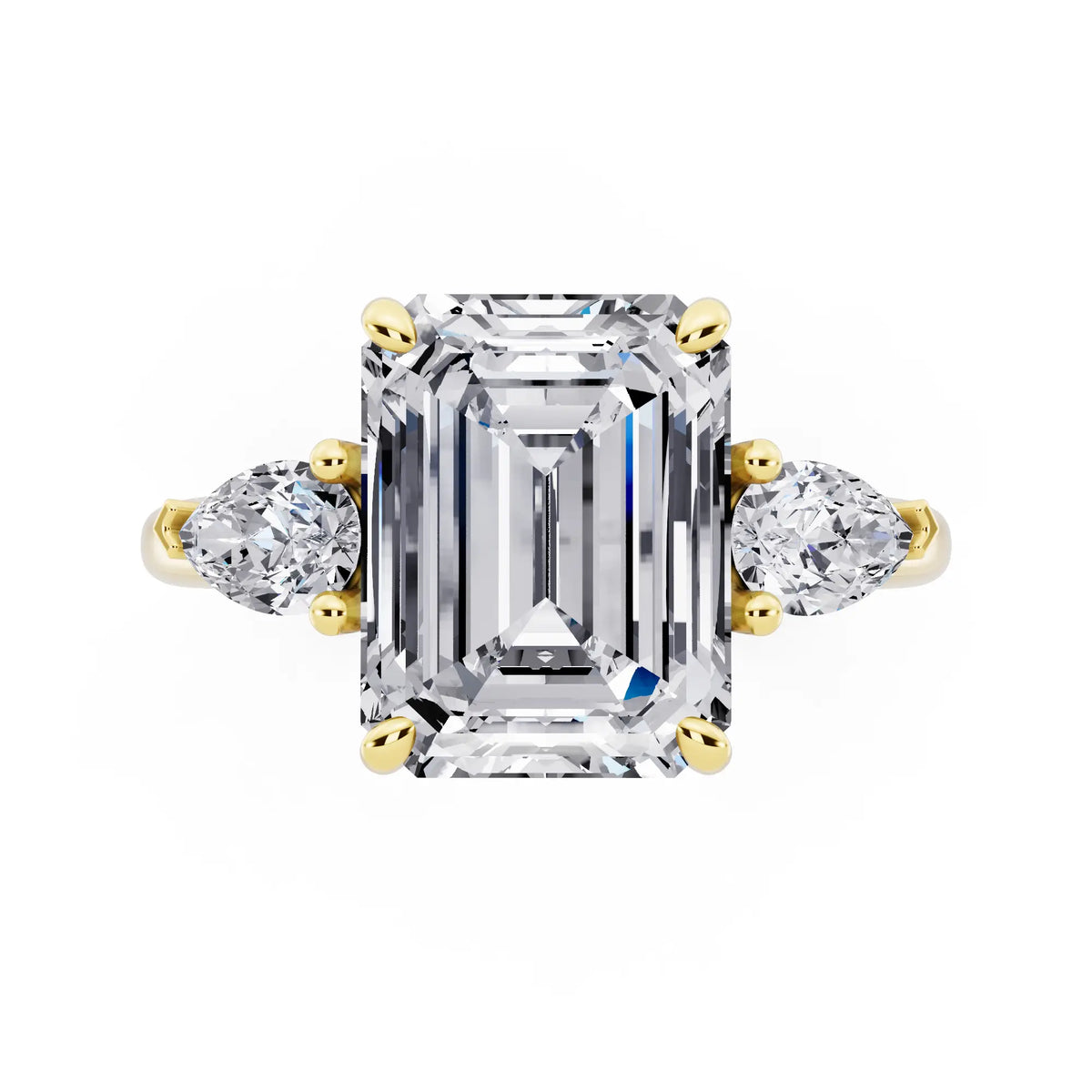 18 KT Yellow Gold Emerald Cut Diamond Three Stone Pear Accent Ring - top angle