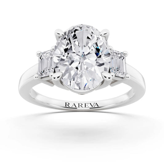 18 KT White Gold Oval Cut Diamond Three Stone Emerald Accent Ring - front view