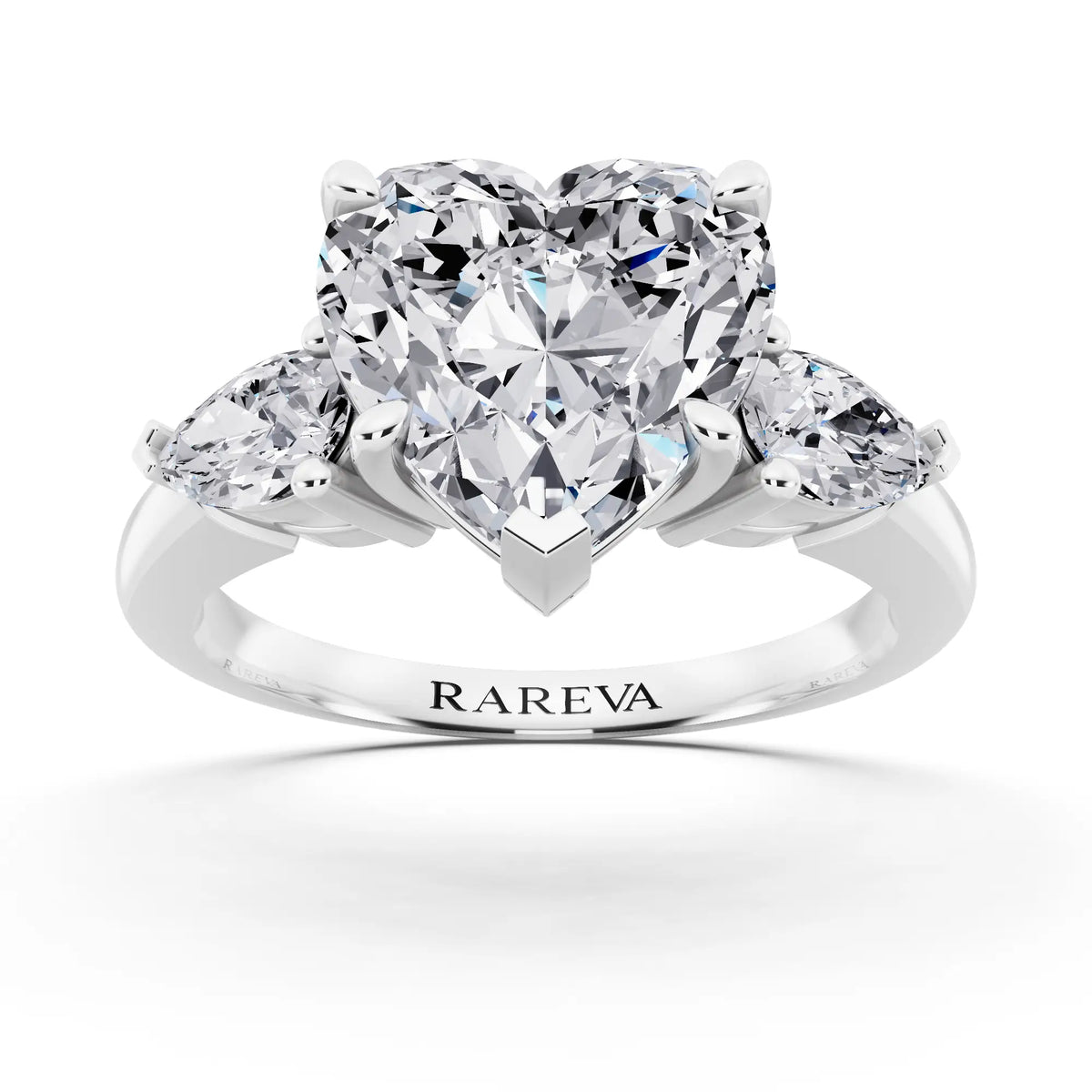 Platinum Heart Cut Diamond Three Stone Pear Accent Ring - front view