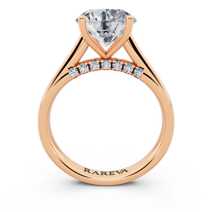 14 KT Rose Gold Round Cut Diamond Solitaire Ring with Hidden Accent - through finger