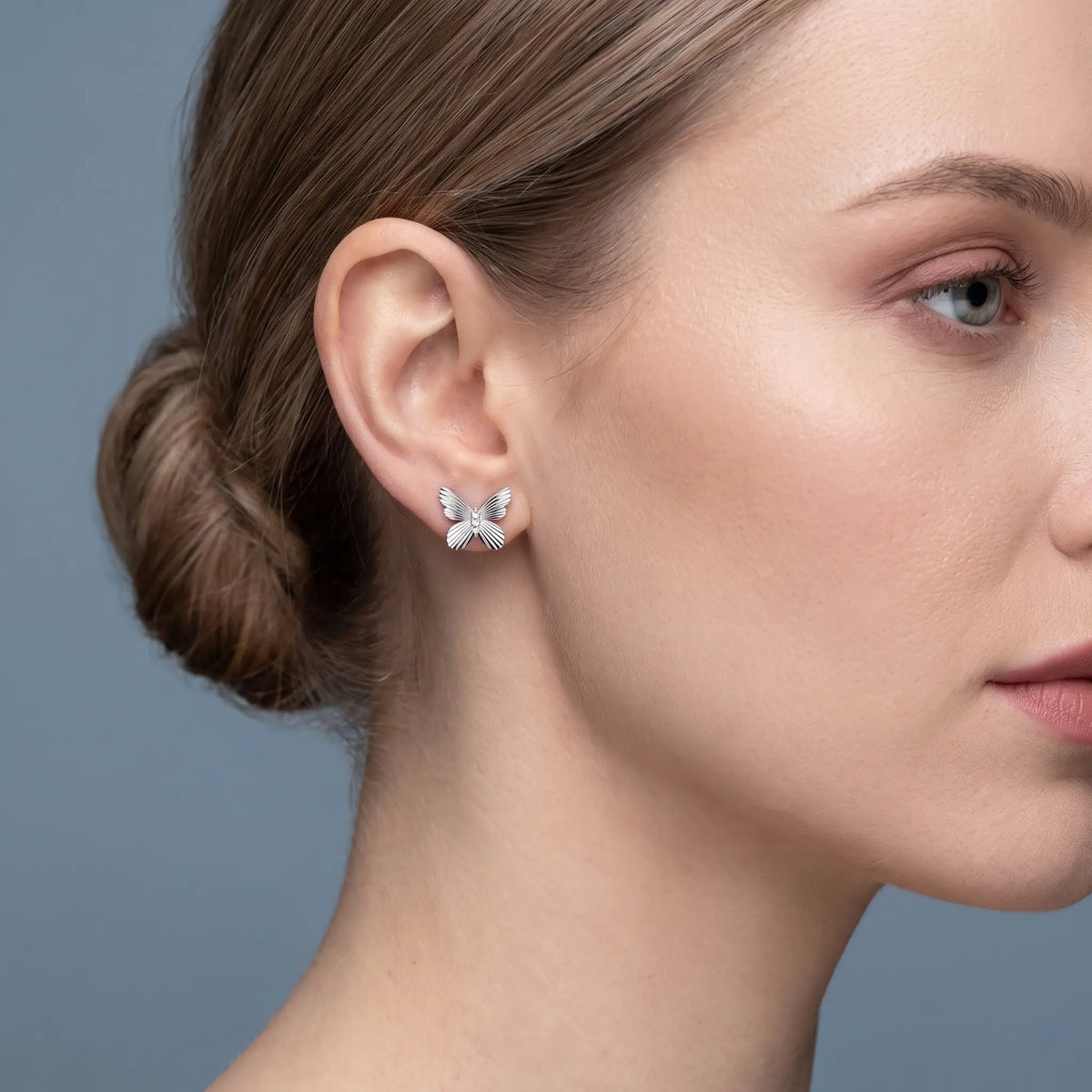 Silver Round Diamond Butterfly Cluster Earrings - worn close up