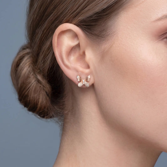 14KT Rose Gold Round Diamond Butterfly Cluster Earrings - worn close up
