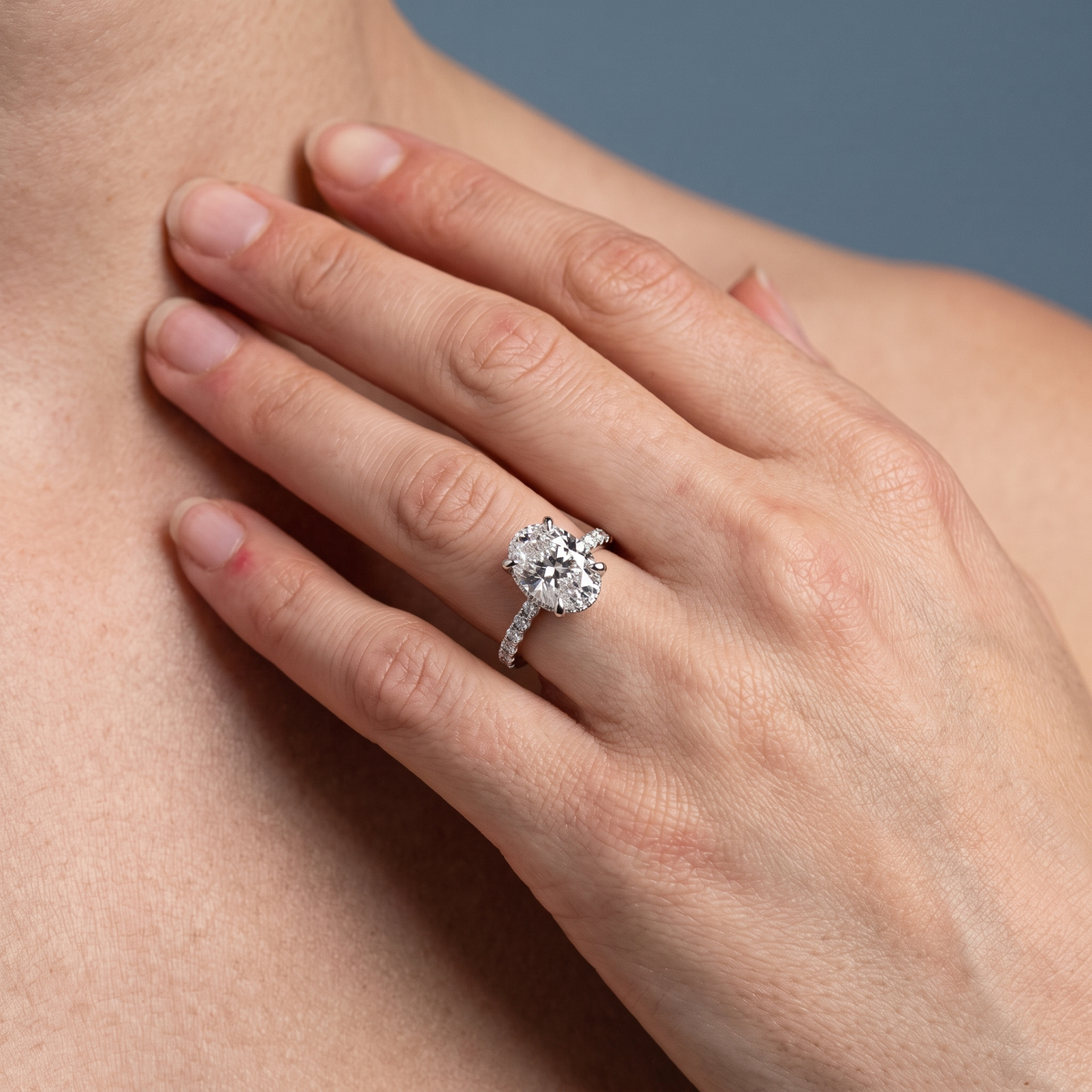 14 KT White Gold Oval Cut Diamond Solitaire Ring - worn close-up