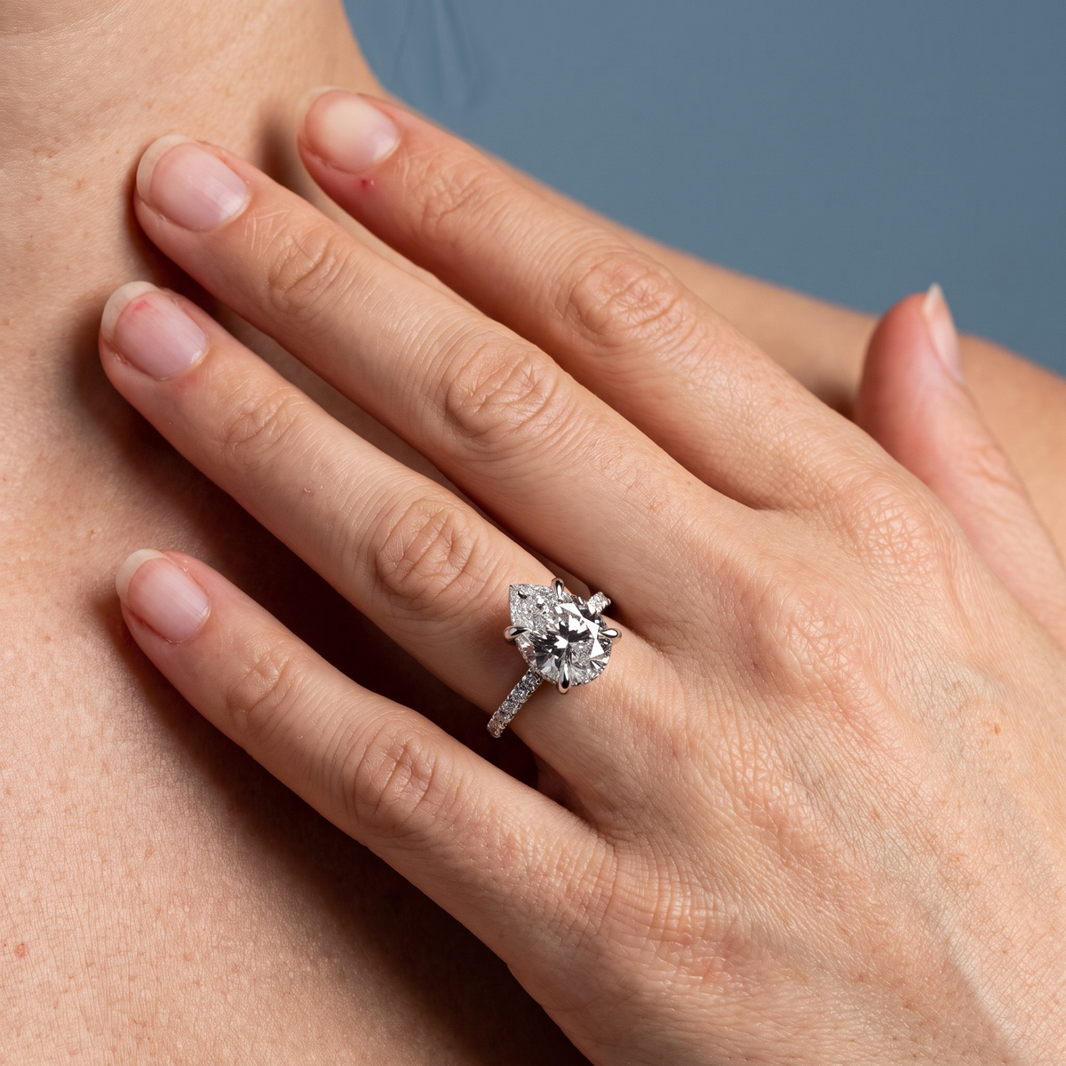 Platinum Pear Cut Diamond Solitaire Ring - worn close-up