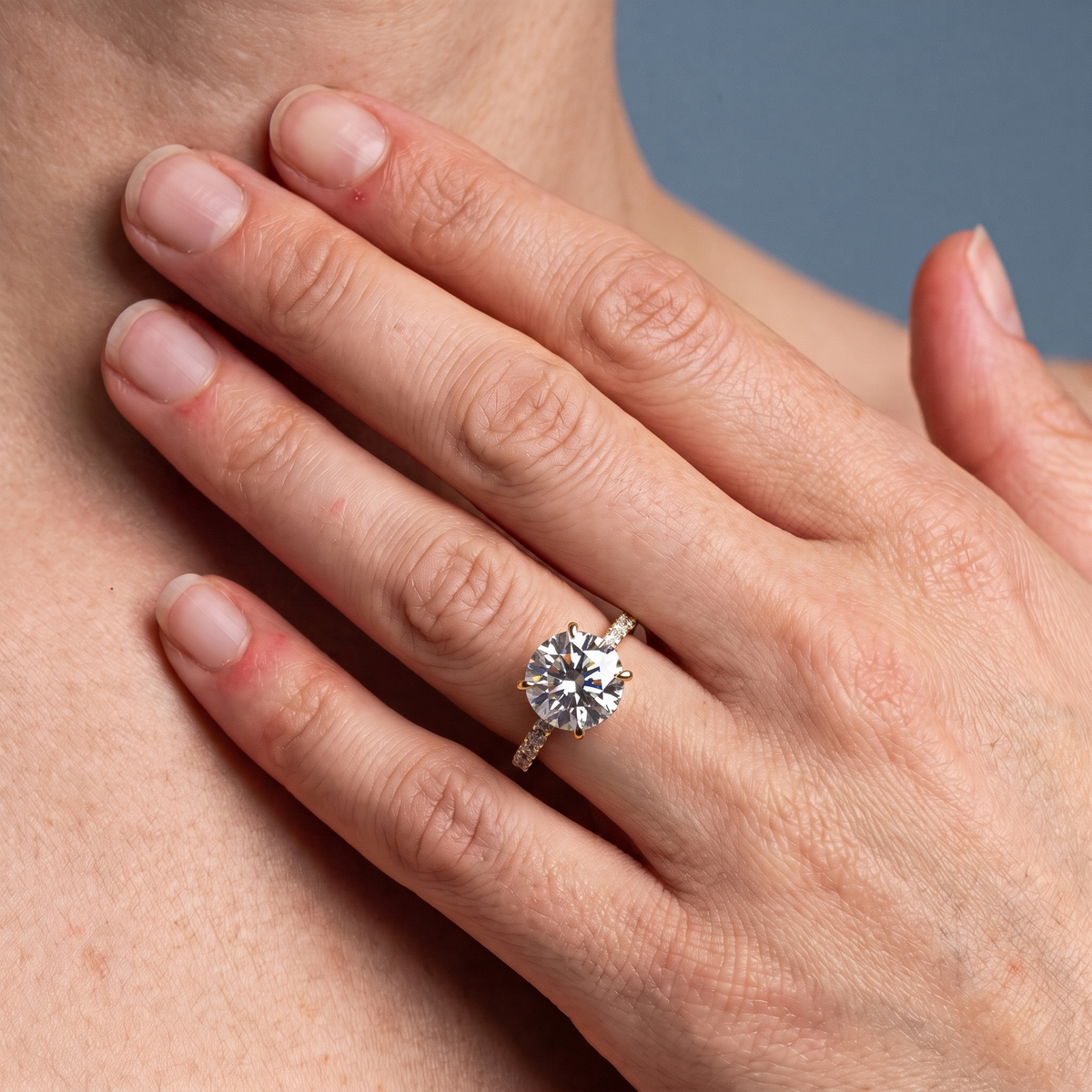 18 KT Yellow Gold Round Cut Diamond Solitaire Ring - worn close-up