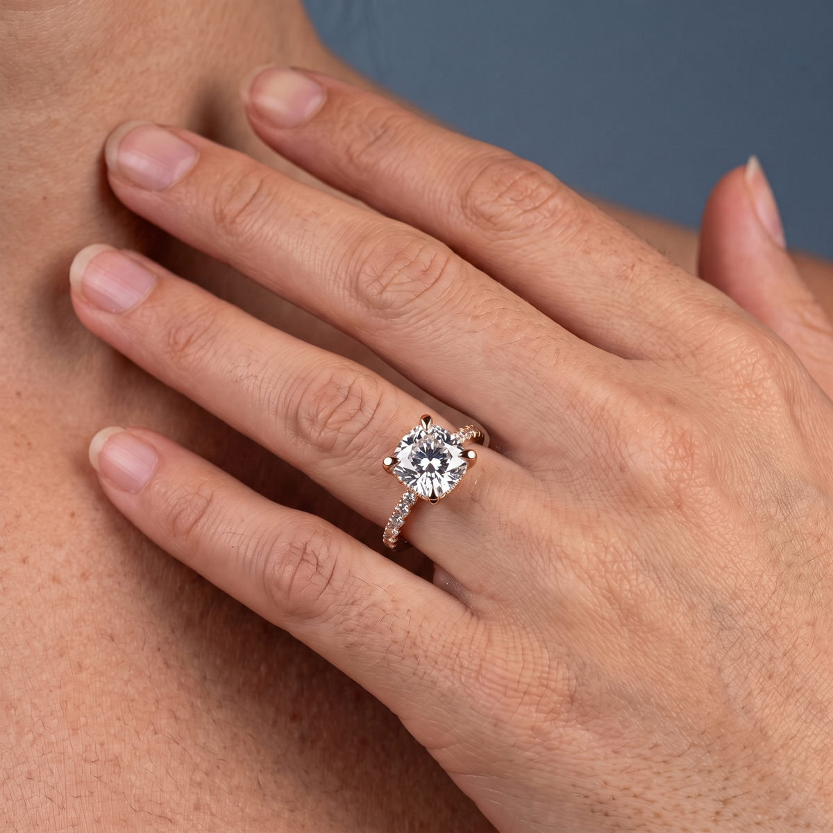 18 KT Rose Gold Cushion Cut Diamond Solitaire Ring - worn close-up