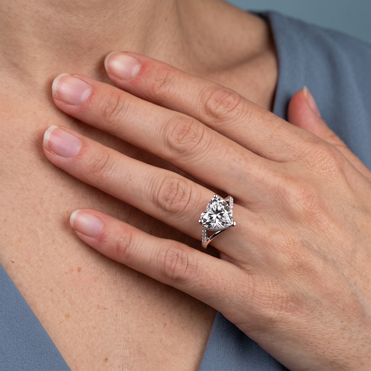 18 KT White Gold Heart Cut Diamond Split Shank Engagement Ring with Hidden Halo - worn close-up