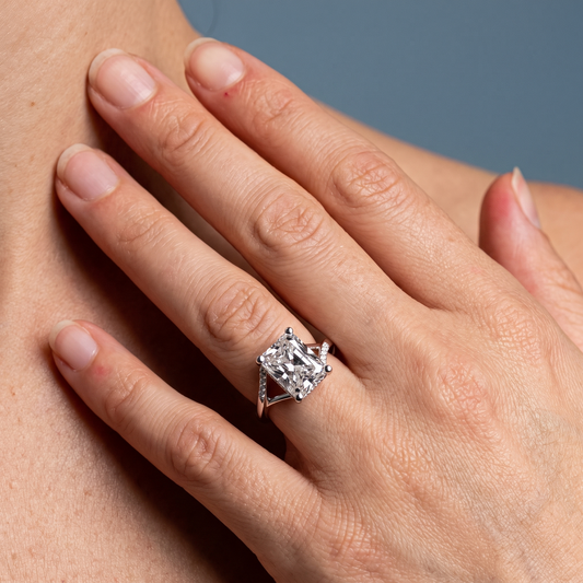 18 KT White Gold Radiant Cut Diamond Split Shank Engagement Ring with Hidden Halo - worn close-up