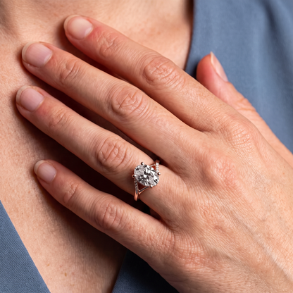 14 KT Rose Gold Oval Cut Diamond Split Shank Engagement Ring with Hidden Halo - worn close-up