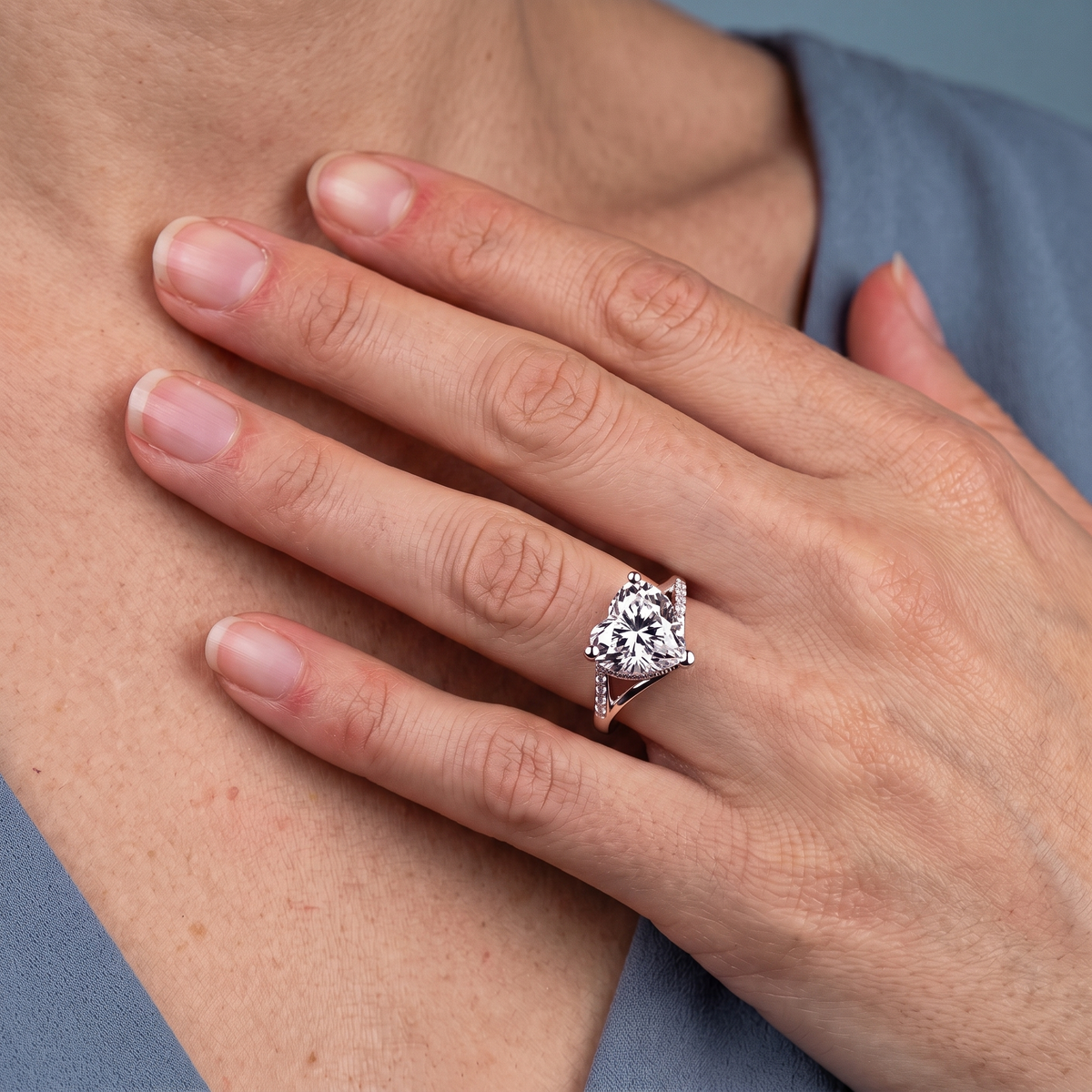 18 KT Rose Gold Heart Cut Diamond Split Shank Engagement Ring with Hidden Halo - worn close-up