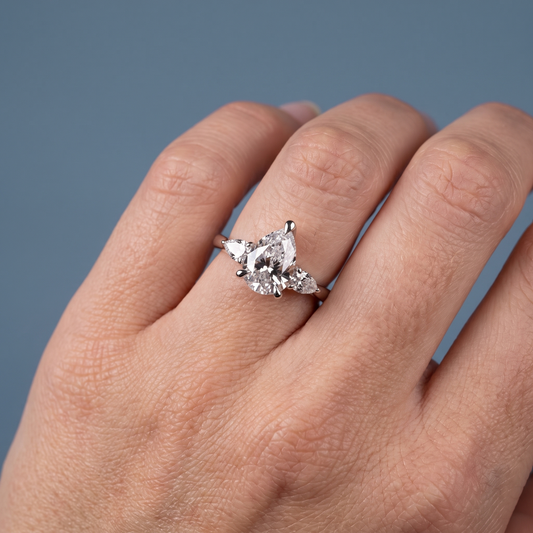 Platinum Pear Cut Diamond Cluster Engagement Ring with Pear Accents - worn close-up