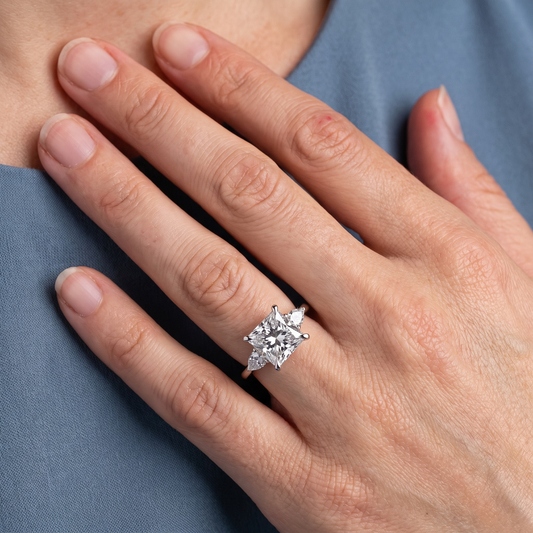 18 KT White Gold Princess Cut Diamond Cluster Engagement Ring with Pear Accents - worn close-up