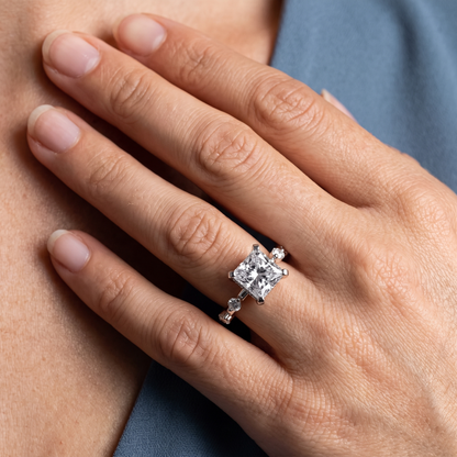 Platinum Princess Cut Diamond Solitaire Ring with Floating Diamond Accents - worn close-up