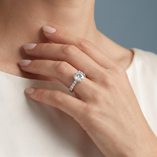18 KT White Gold Round Cut Diamond Solitaire Ring with Pave Eternity Band - worn close-up