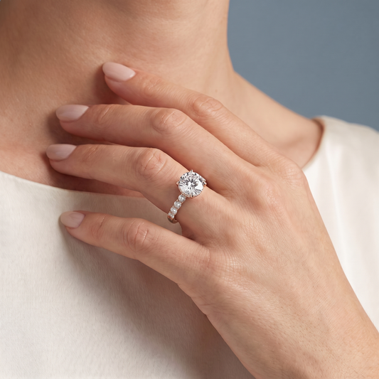 18 KT Rose Gold Round Cut Diamond Solitaire Ring with Hidden Halo and Pave Band - worn close-up