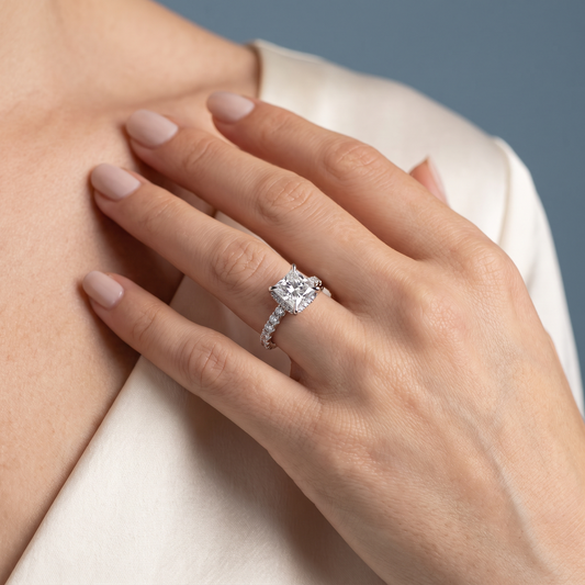 14 KT White Gold Princess Cut Diamond Solitaire Ring with Hidden Halo and French Pave Band - worn close-up