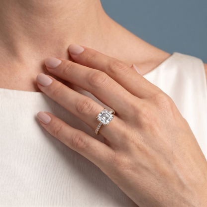 18 KT Yellow Gold Asscher Cut Diamond Solitaire Ring with Hidden Halo and French Pave Band - worn close-up