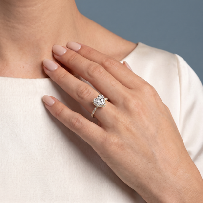 14 KT Yellow Gold Heart Cut Diamond Solitaire Ring with Hidden Halo and French Pave Band - worn close-up