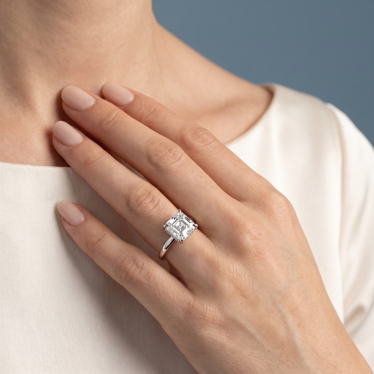 14 KT White Gold Asscher Cut Diamond Solitaire Ring with Cathedral Band - worn close-up