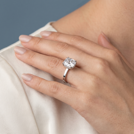 Platinum Cushion Cut Diamond Solitaire Ring with Hidden Halo - worn close-up