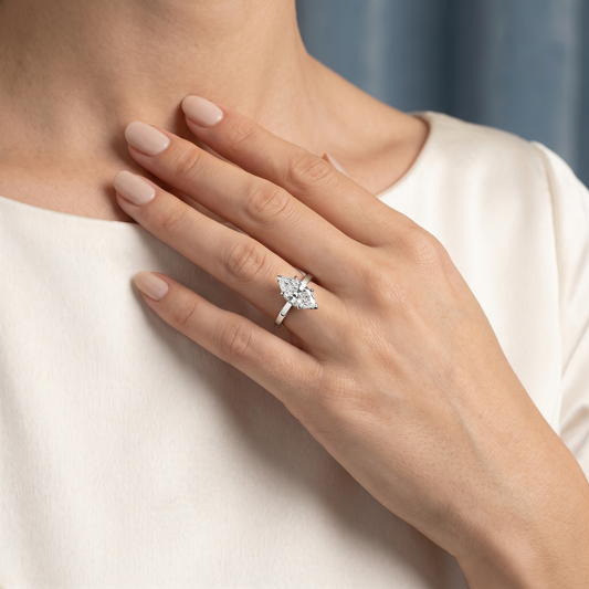 18 KT White Gold Marquise Cut Diamond Solitaire Ring with Hidden Halo - worn close-up
