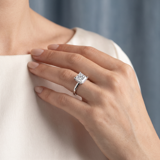 18 KT White Gold Princess Cut Diamond Hidden Halo Solitaire Ring - worn close-up