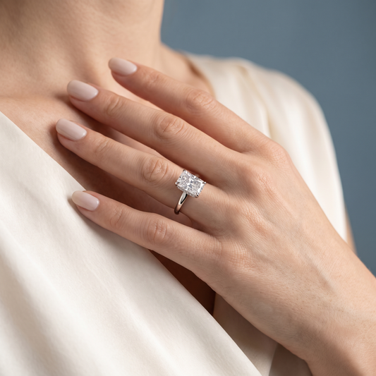 18 KT White Gold Radiant Cut Diamond Hidden Halo Solitaire Ring - worn close-up