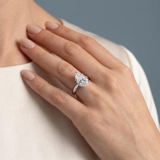 14 KT White Gold Pear Cut Diamond Hidden Halo Solitaire Ring - worn close-up
