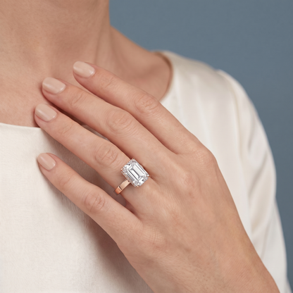 14 KT Rose Gold Emerald Cut Diamond Solitaire Ring with Hidden Halo - worn close-up