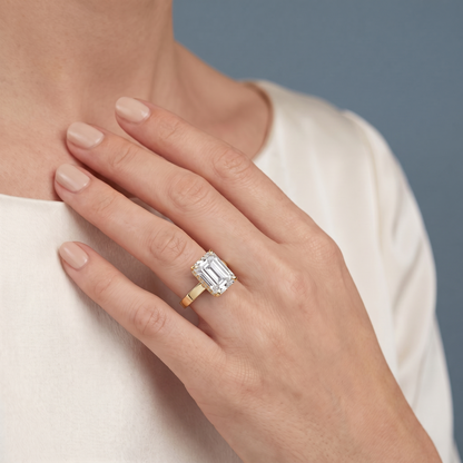 14 KT Yellow Gold Emerald Cut Diamond Solitaire Ring with Pave Collar - worn close-up