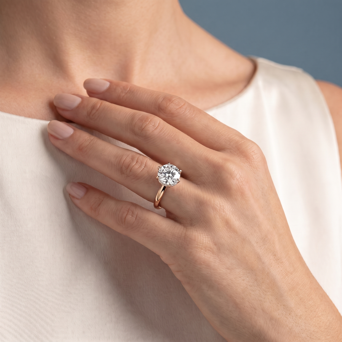 14 KT Rose Gold Round Cut Diamond Hidden Halo Solitaire Ring - worn close-up