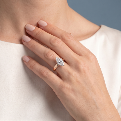 18 KT Rose Gold Marquise Cut Diamond Hidden Halo Solitaire Ring - worn close-up