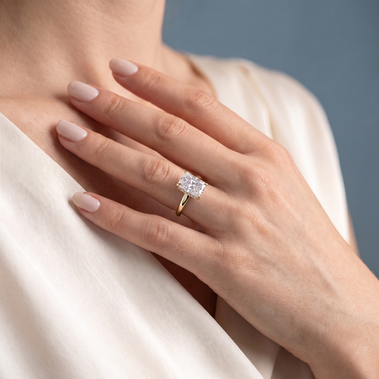 18 KT Yellow Gold Radiant Cut Diamond Hidden Halo Solitaire Ring - worn close-up