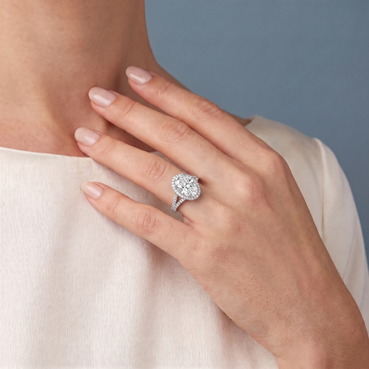Platinum Oval Cut Diamond Halo Ring with Split Shank - worn close-up