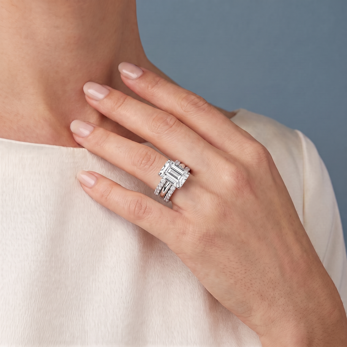 Platinum Emerald Cut Diamond Solitaire Twin Pave Band Stack Ring - worn close-up