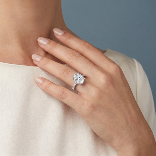 Platinum Oval Cut Diamond Hidden Halo Ring with Pave Shank - worn close-up