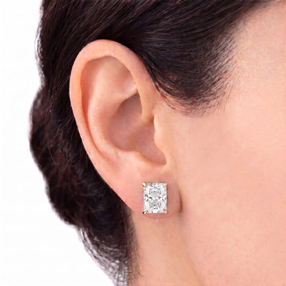 Radiant cut tiger-prong diamond stud earring in rose gold worn on ear