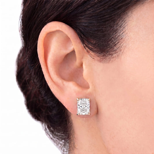 Radiant cut tiger-prong diamond stud earring in rose gold worn on ear